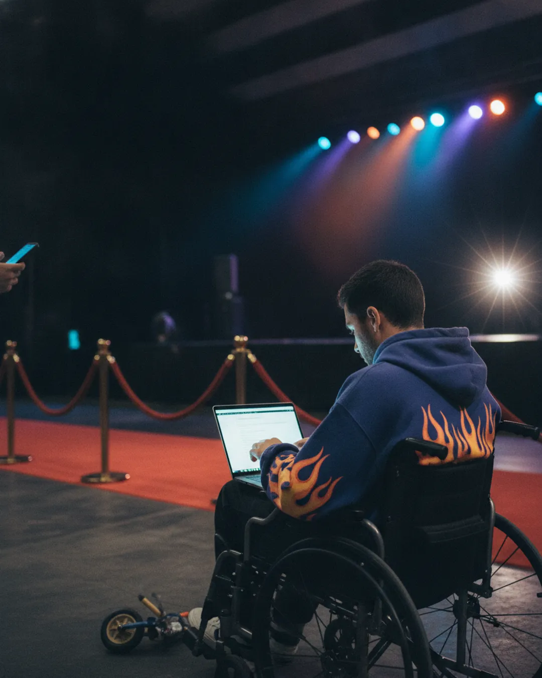 person in a wheelchair using a laptop